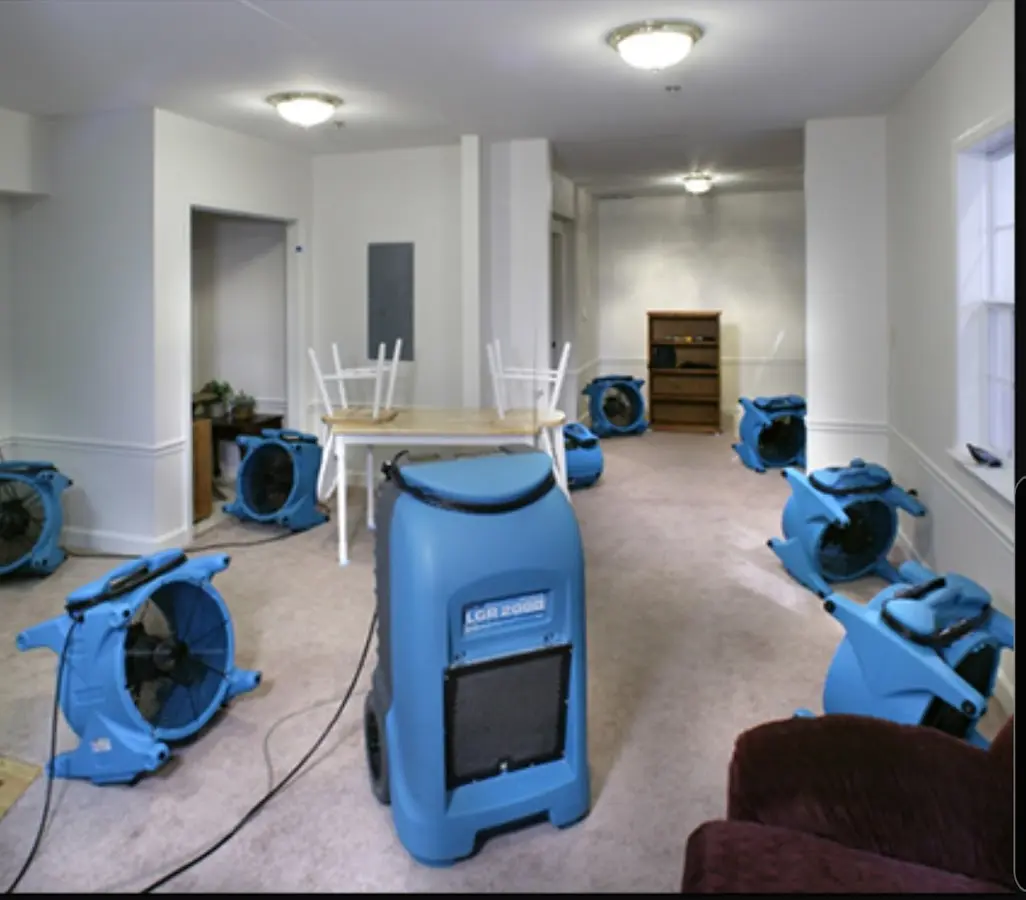 Air movers and dehumidifier setup for Water Damage Restoration in New Boston